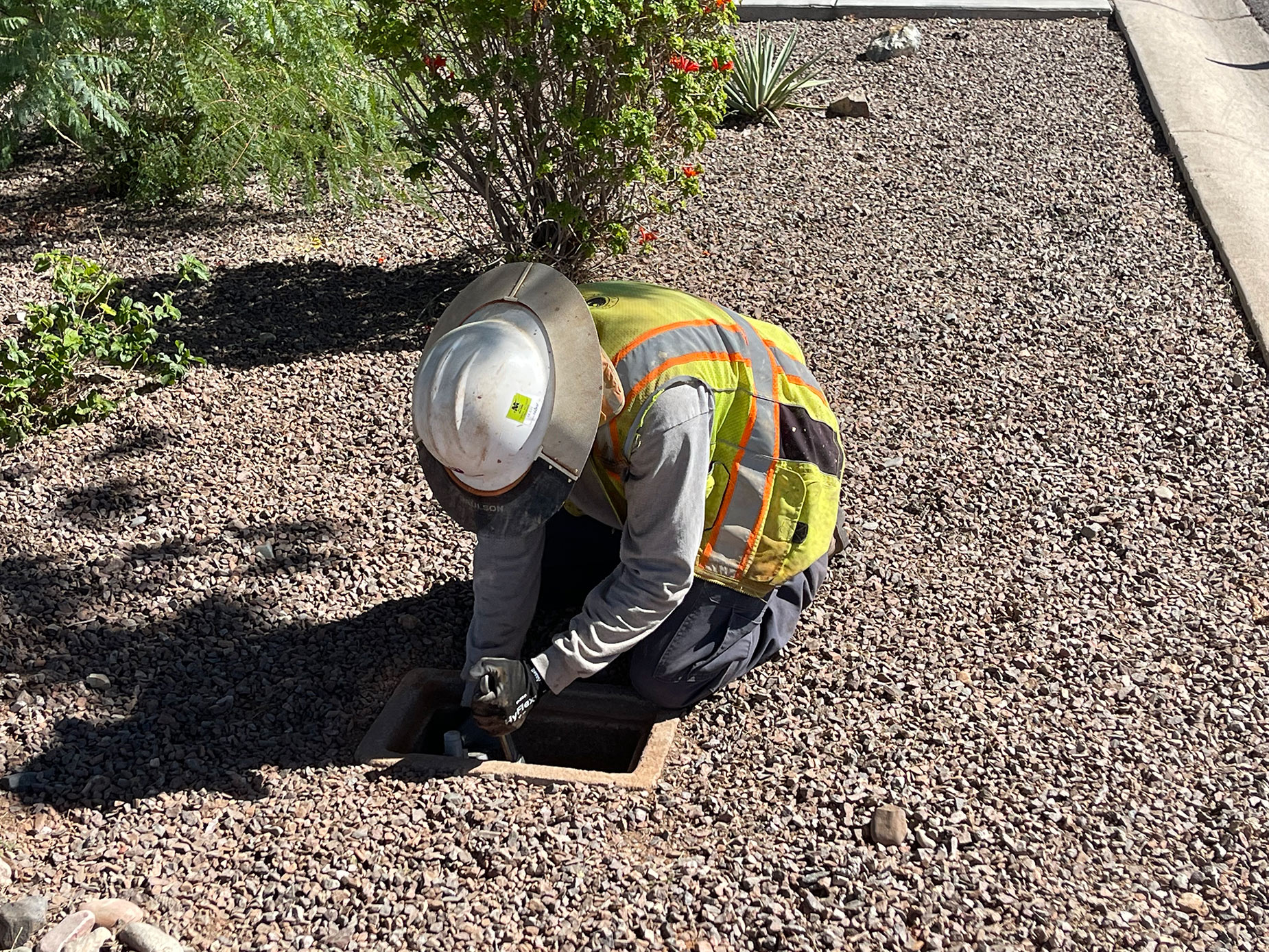 City employee checking a water service line.